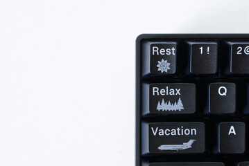 Obraz premium Unusual office computer keyboard interface with rest, relax and vacation buttons. The concept of solving the problem of overwork from office work and computer use.