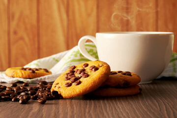 Morning kitchen table with hot coffee, oat cookies, napkin