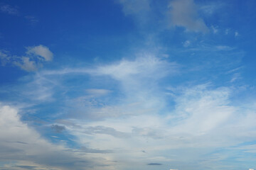Naklejka na ściany i meble Bright blue sky and white clouds background.