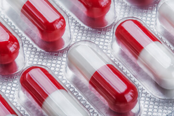 Red capsules. Medicine. The science. Pills for diseases.