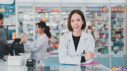 Pharmacy counters have pill products that take care of your health.Female pharmacist working at a pharmacy.An adult doctor smiling at a drugstore.