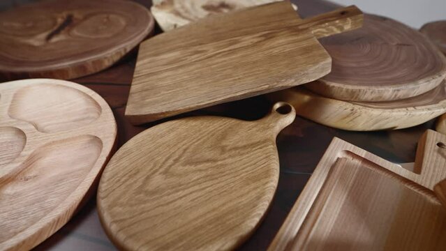 Lots of wooden cutting boards produced in a craft workshop.