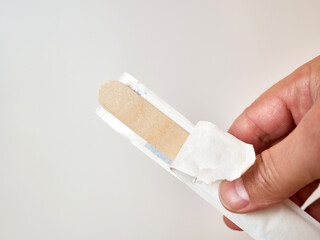 Unpack the wooden otolaryngological spatula for patient examination.