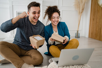 couple woman and man open presents gift during video call online