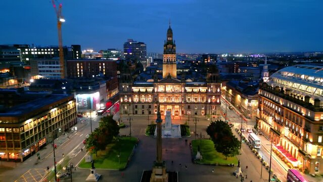 Flight over George Square in Glasgow City Center at night - aerial view - travel photography