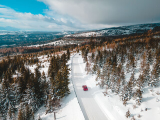 aerial view of snowed road in tatra mountains - obrazy, fototapety, plakaty