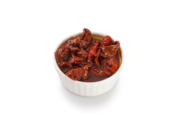 Sun dried tomatoes with olive oil in ceramic jar isolated on a white background, clipping path, cut out. Sun-dried tomatoes.