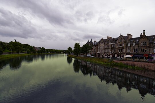 Houses On The Bank Of The River Ness In Scotland