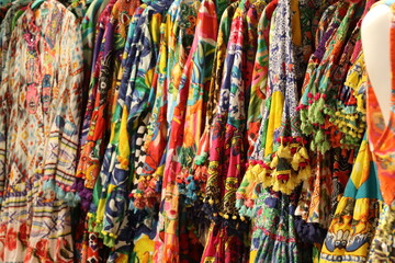 Fototapeta premium colorful summer women's clothes on display colorful summer women's clothes on display