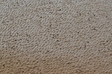 Sand on the beach at low tide background, Weston-super-Mare beach, England, UK