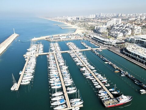 Aerial view of  Ashkelon marina with aligned boats in Ashkelon, Israel on a sunny day
