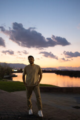 Young tall man at sunset view.