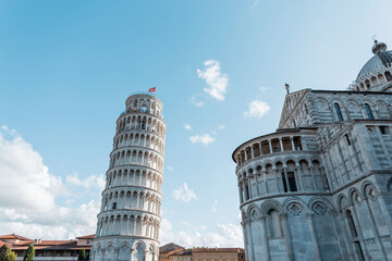 Fototapeta na wymiar Beautiful amazing cathedral buildings with Romanesque architecture facades in the European town of Pisa, Italy