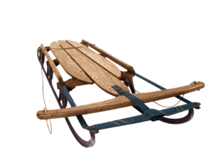 Antique wood snow sled isolated.