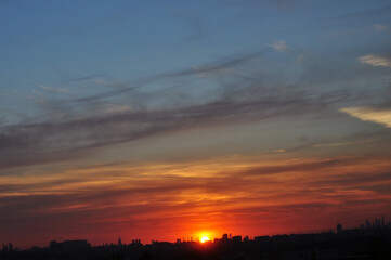 beautiful sunset sky over the city horizon