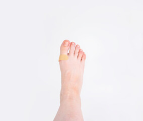 foot with natural manicure and plaster