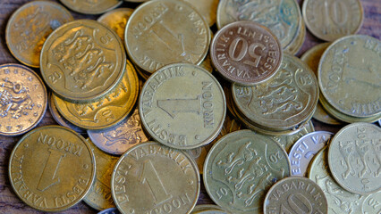 Various coins of the old inactive Republic of Estonia. Senti, krona 2001 coin close-up isolated on wooden background