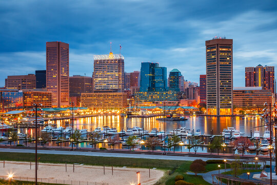 View on Baltimore skyline and Inner Harbor from Federal Hill at dusk, Maryland