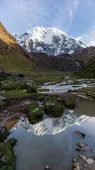 The mountain view is mesmerizing. The water elements such as lakes, waterfalls, or rivers highlight how the mountains have been shaped. 
The color change between autumn and spring is breathtaking!