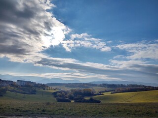 View to the city over the meadow, hills and buildings in the town. Slovakia