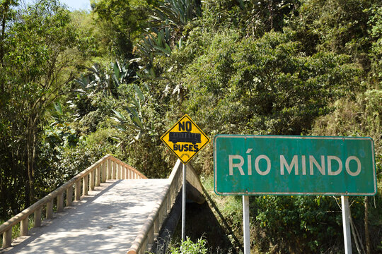 Road sign near bridge over Rio Mindo