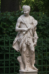 Obraz premium Marble statue of allegory of noon in Summer Garden, Saint Petersburg, Russia