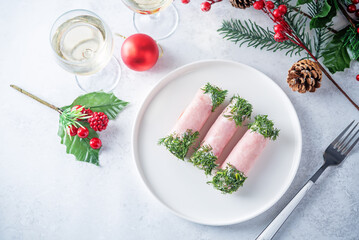 Ham cheese garlic rolls decorated with dill and cream sauce