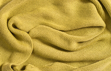 Warm cozy green knitwear closeup, texture background. Minimalism, copy space, place for text