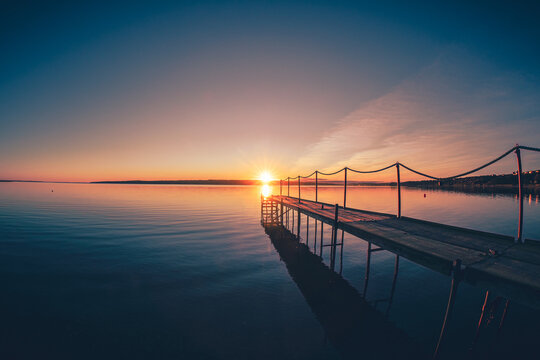 Jetty in the Sunrise at Limfjord in Denmark. High quality photo