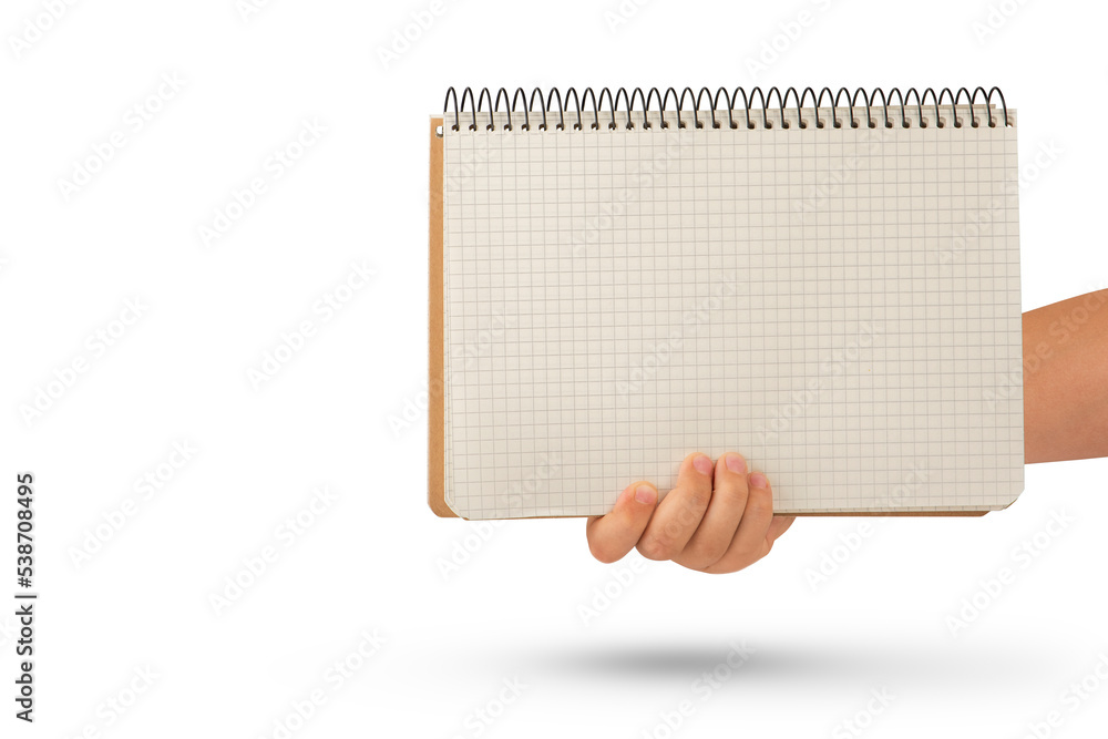Wall mural empty notepad in hand. a hand holds a blank notepad with copy space, isolated on a white background.
