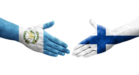 Handshake between Finland and Guatemala flags painted on hands, isolated transparent image.