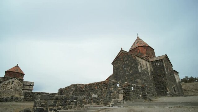View of an old castle. Action. Ancient stone village with old buildings, concept of history.