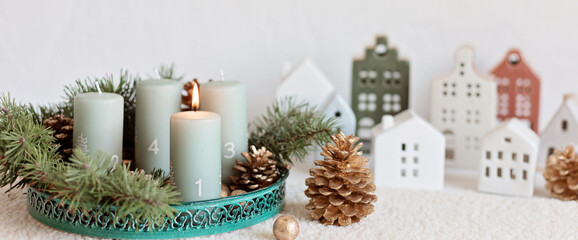 Handmade modern advent wreath with four candles lit every sunday before christmas. Traditional diy...