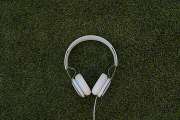 headphones on grass background