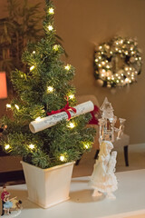 Christmas decor includes a tree with a scroll, a figurine holding a nutcracker and a wreath.