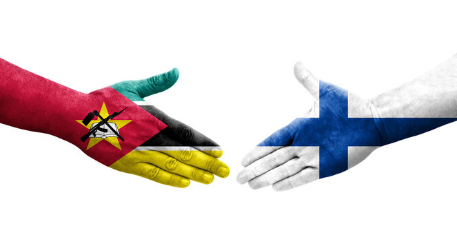 Handshake between Finland and Mozambique flags painted on hands, isolated transparent image.