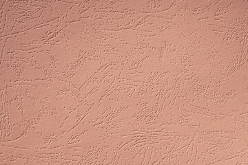 Closeup photo of cardboard sheet surface in beige peach color. Unicolor textured background.