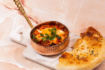 Shakshouka in a copper pot