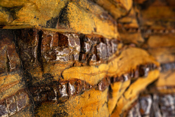 Natural rock texture of a colorful rock formations in silence beach (playa del Silencio) in Asturias, north of Spain.