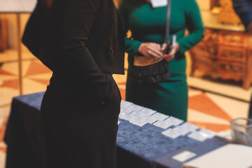 Process of checking in on a conference congress forum event, registration desk table, visitors and...