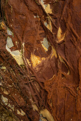 Natural rock texture of a colorful rock formations in silence beach (playa del Silencio) in Asturias, north of Spain.