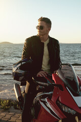 Fototapeta premium Portrait of a motorcycle rider with sunglasses