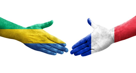 Handshake between France and Gabon flags painted on hands, isolated transparent image.