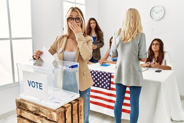 Group of young girls voting at democracy referendum shocked covering mouth with hands for mistake....