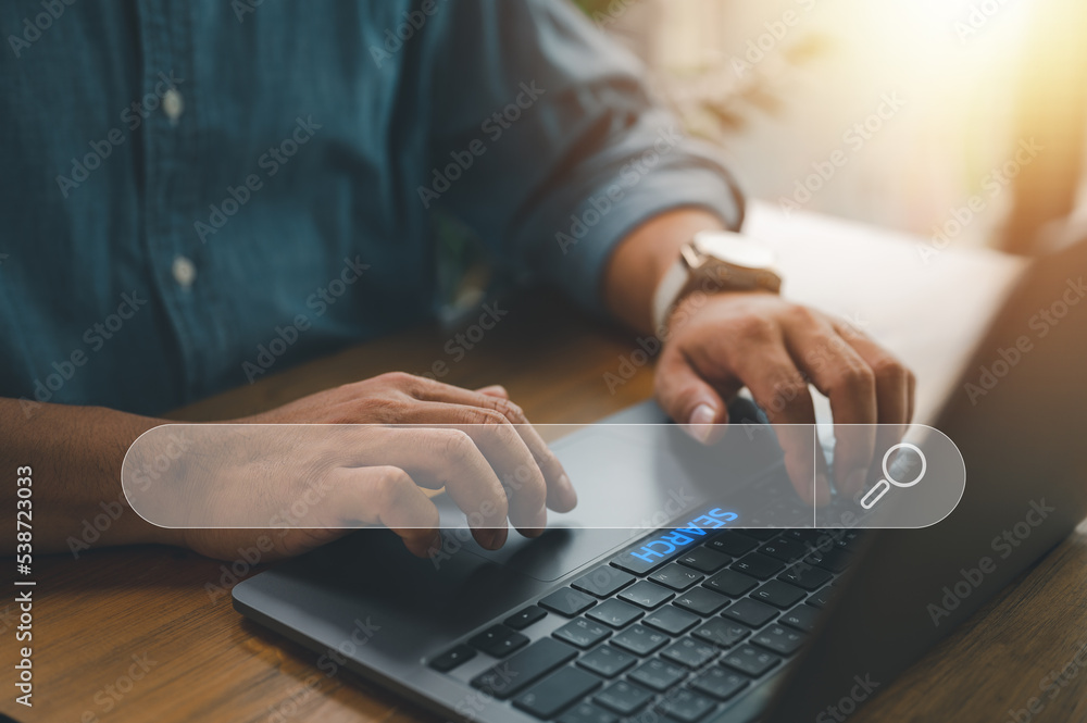 Fototapete Data Search Technology Search Engine Optimization. man's hands are using a computer notebook to Searching for information. Using Search Console with your website..