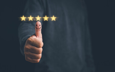 Customer satisfaction concept. Hand with thumb up Positive emotion smile face icon and five star with copy space. best review, customer experience, feed back..