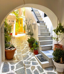 Stairs in archway in stucco building on Naxos, Greece