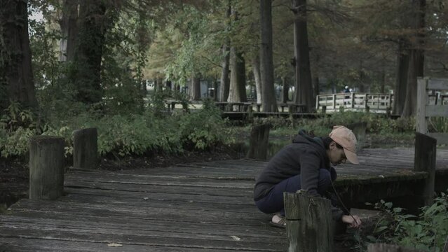 Young Woman Enjoys Nature Photography at Reelfoot Lake State Park 4K