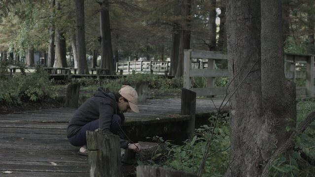 Young Woman Enjoys Nature Photography at Reelfoot Lake State Park 4K
