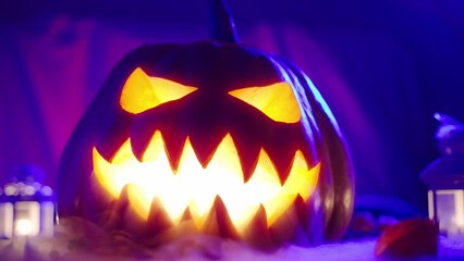 The sinister smile of a pumpkin releases thick smoke and decorates Halloween.